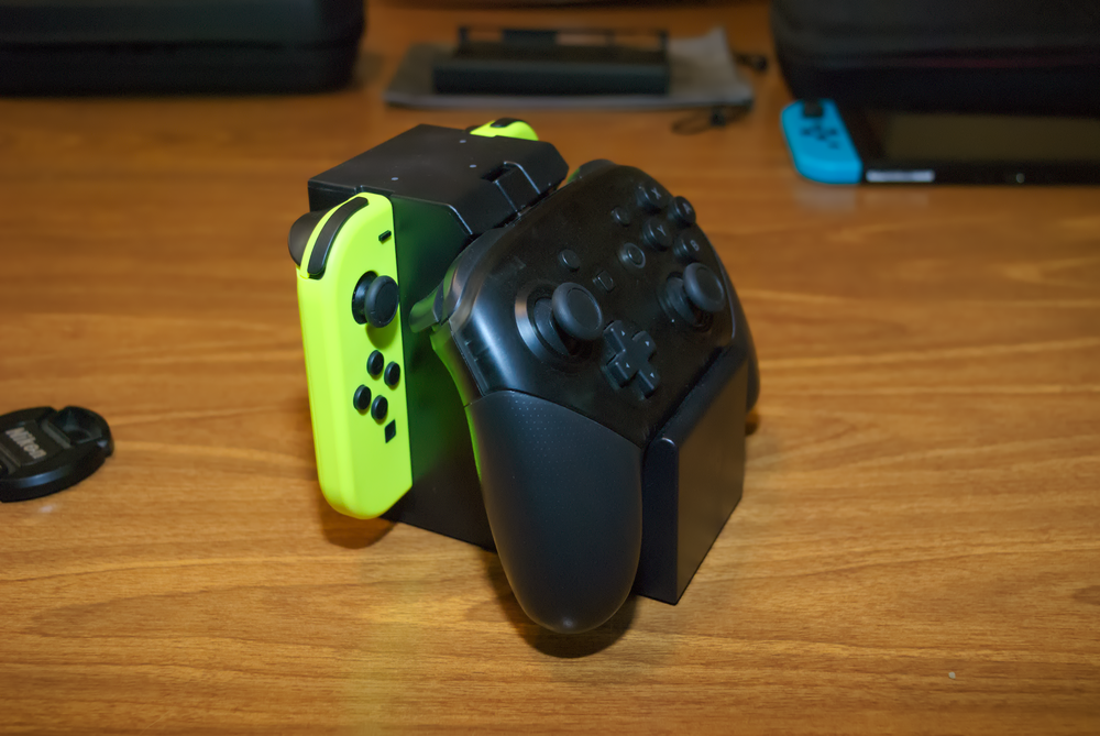 Dock with a pro controller and two joy-cons inserted